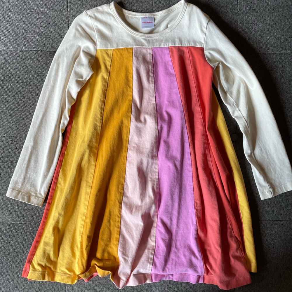 Hanna Andersson White and Rainbow Swimg Dress with warm tones